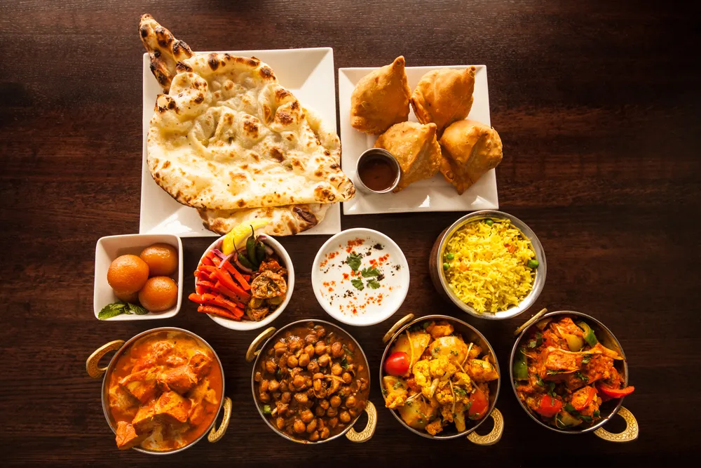 Contact Clay Oven Winnipeg — Authentic East Indian Restaurant at Kenaston Common and Downtown Blue Cross Park