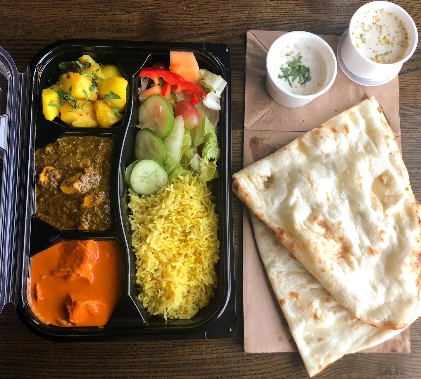 Butter Chicken with naan – Clay Oven's signature East Indian curry in Winnipeg